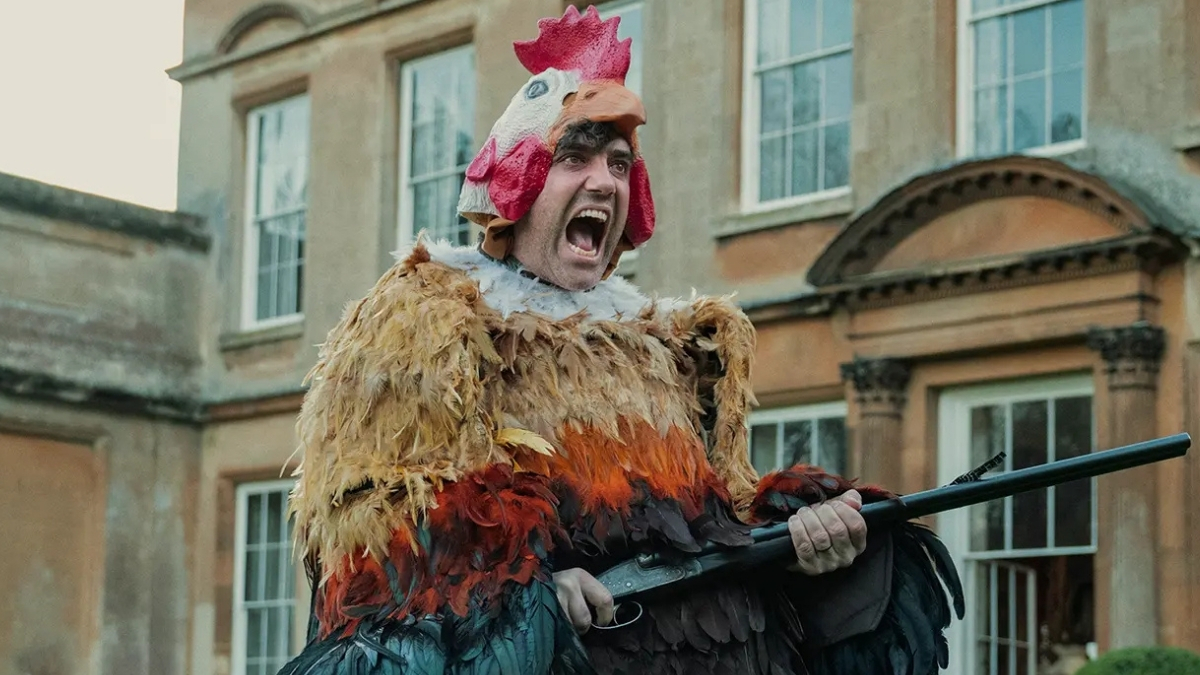 Freddy Horniman déguisé en poulet avec un fusil de chasse